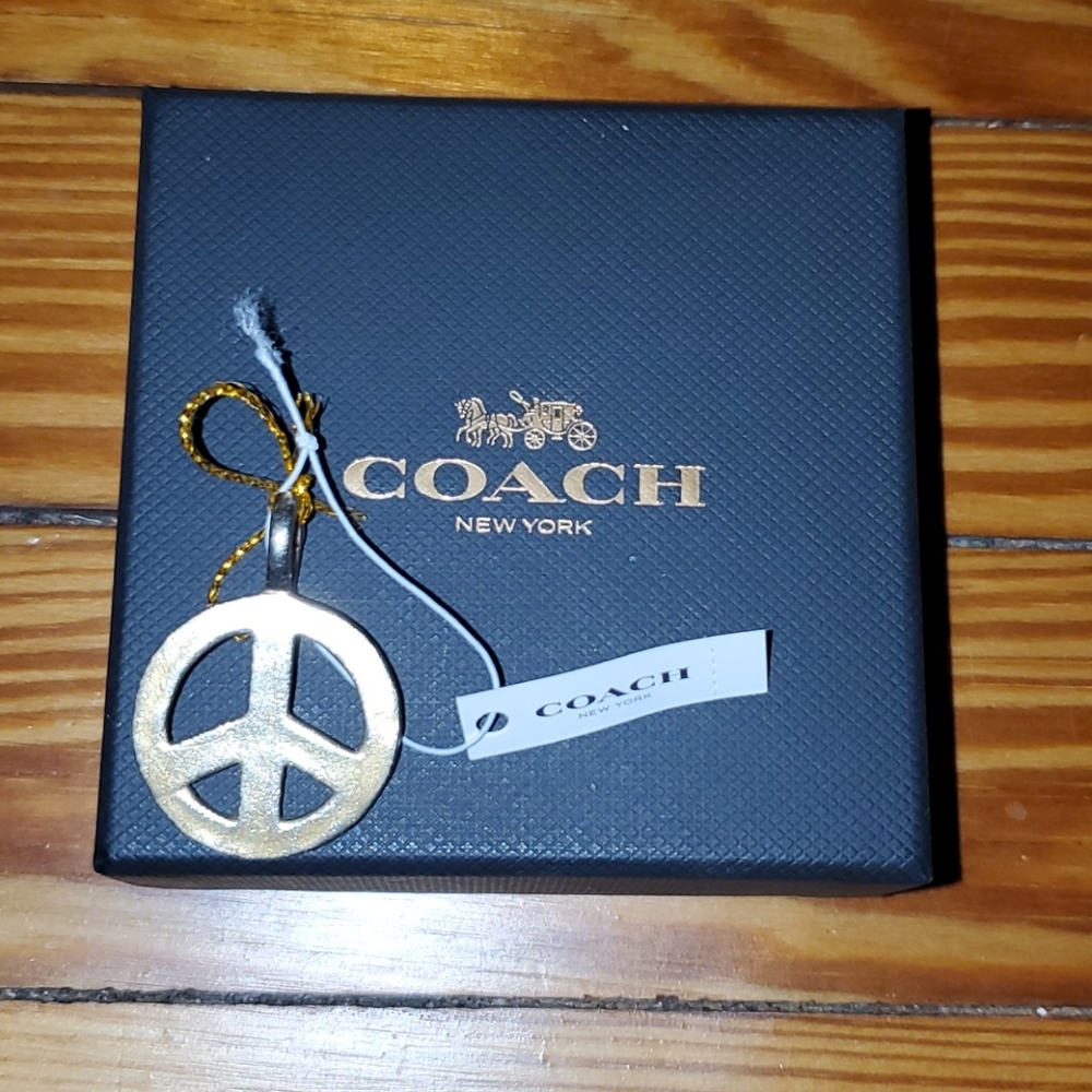 Coach peace sign charm